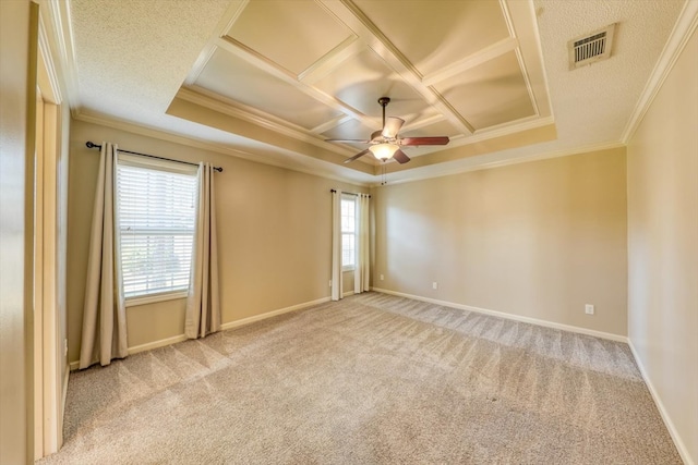 carpeted empty room featuring coffered ceiling, a healthy amount of sunlight, ceiling fan, and ornamental molding