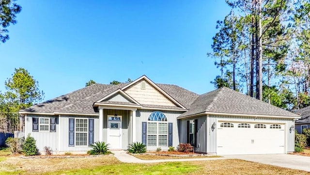 view of front of home featuring a garage and a front yard