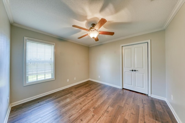 unfurnished bedroom featuring ornamental molding, hardwood / wood-style floors, and ceiling fan