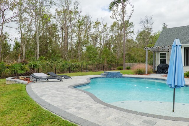 view of pool with a patio area and a lawn