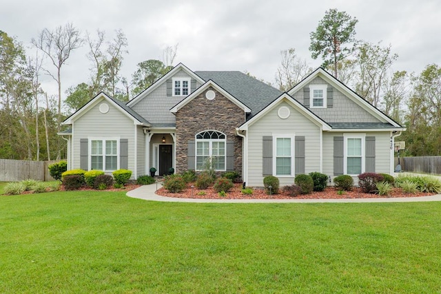 craftsman-style home featuring a front lawn