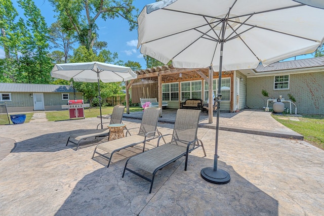 view of patio with an outbuilding, fence, a pergola, and area for grilling