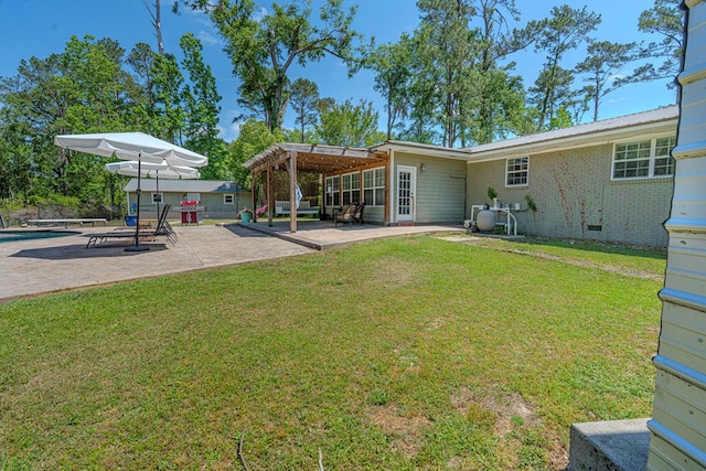 view of yard with a pergola, fence, and a patio