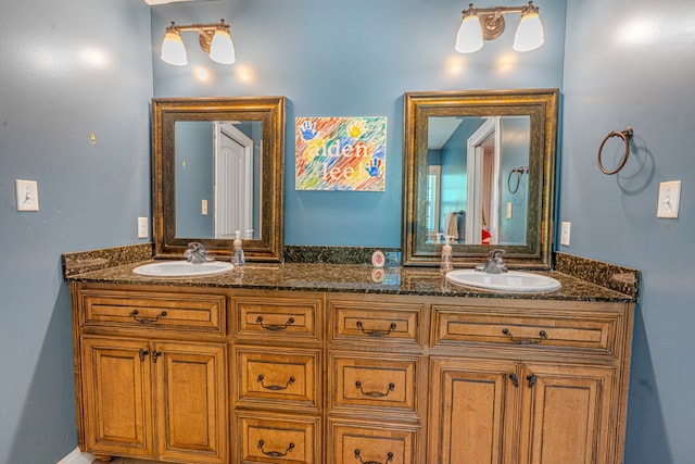 full bathroom featuring double vanity and a sink