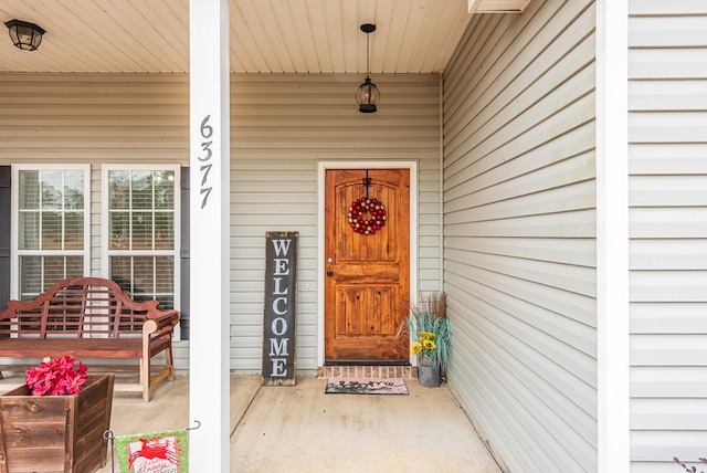 property entrance featuring covered porch