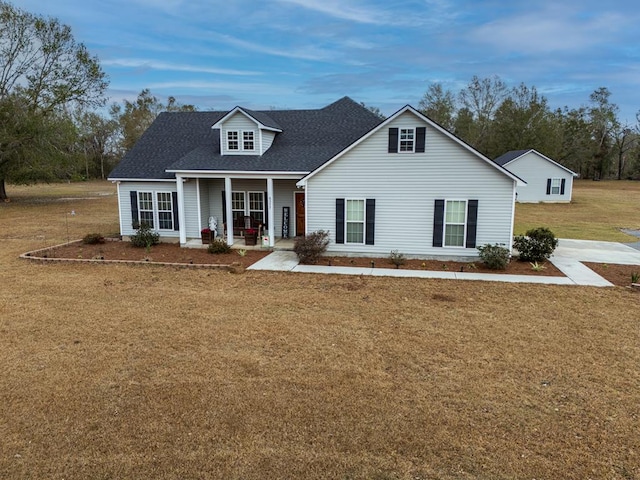 cape cod-style house with a front yard and a porch