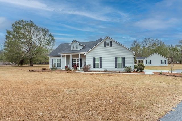 view of front facade with a porch and a front lawn