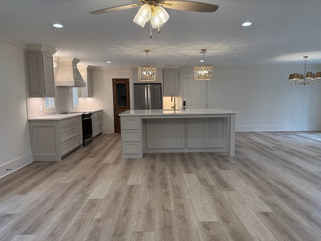 kitchen featuring black / electric stove, custom exhaust hood, stainless steel refrigerator, and gray cabinets