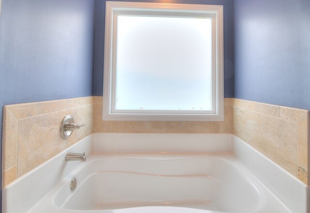 bathroom with a garden tub