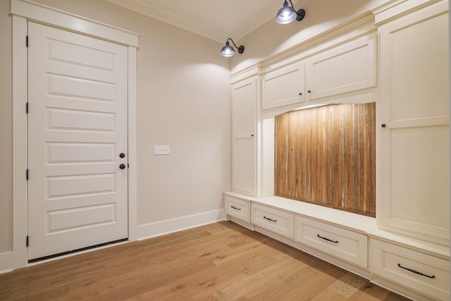 mudroom with ornamental molding and light hardwood / wood-style flooring