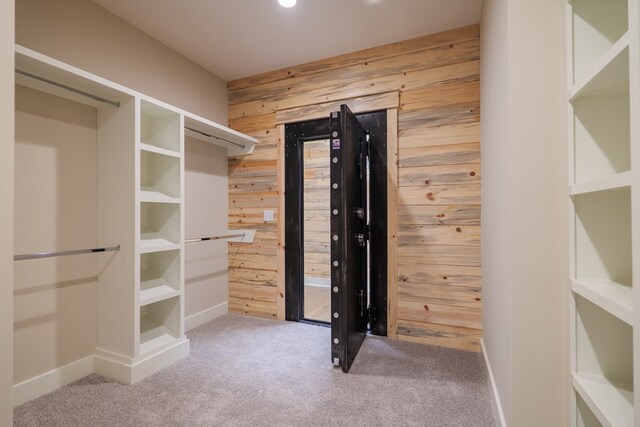 walk in closet with carpet flooring