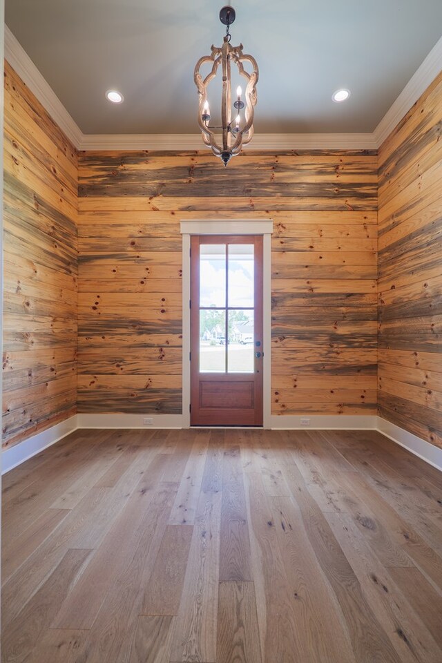 interior space with hardwood / wood-style floors and a chandelier