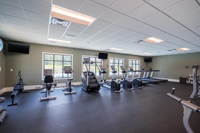 exercise room with a paneled ceiling