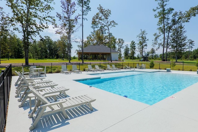 view of swimming pool with a gazebo and a patio area