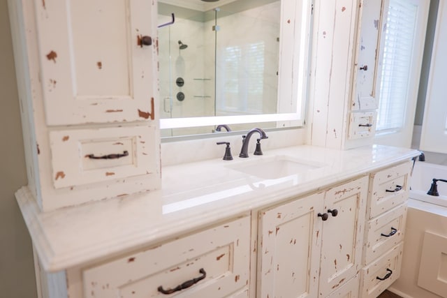 bathroom featuring vanity and a shower with door