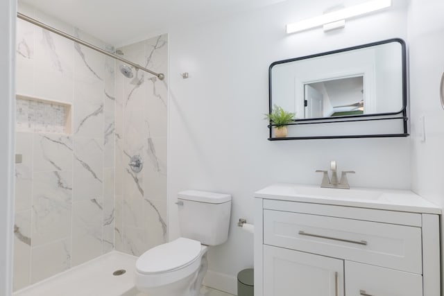 4310 Old Quitman Hwy, Valdosta, GA 31601 - bathroom featuring vanity, toilet, a marble finish shower, and baseboards