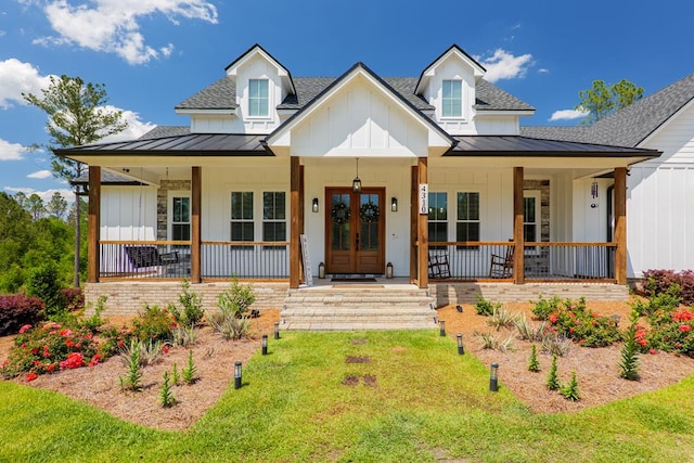 4310 Old Quitman Hwy, Valdosta, GA 31601 - modern farmhouse featuring a standing seam roof, covered porch, and roof with shingles
