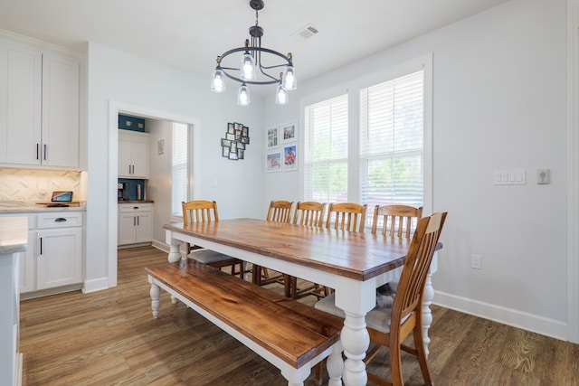 4310 Old Quitman Hwy, Valdosta, GA 31601 - dining room featuring a chandelier, light wood-style flooring, and baseboards