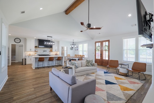 4310 Old Quitman Hwy, Valdosta, GA 31601 - living room featuring recessed lighting, beam ceiling, dark wood finished floors, french doors, and a chandelier