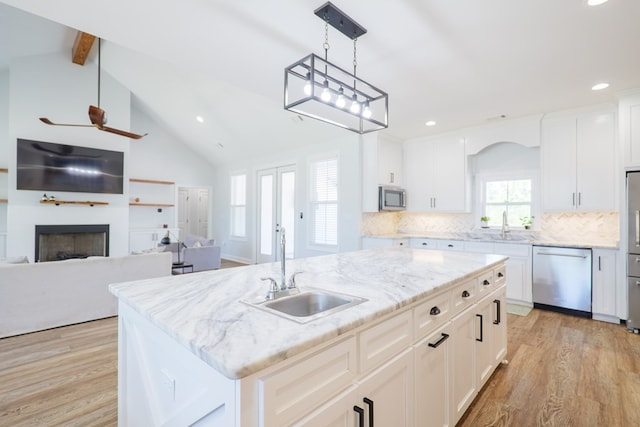 4310 Old Quitman Hwy, Valdosta, GA 31601 - kitchen featuring stainless steel appliances, a sink, light wood-type flooring, recessed lighting, and decorative backsplash