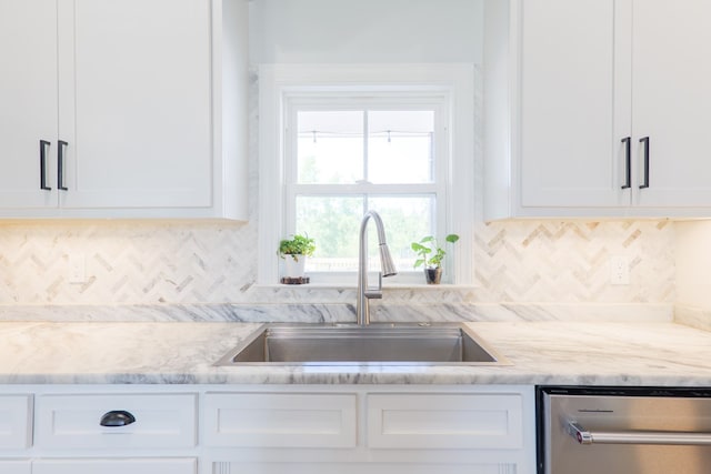 4310 Old Quitman Hwy, Valdosta, GA 31601 - kitchen featuring dishwasher, a sink, white cabinetry, tasteful backsplash, and light stone counters