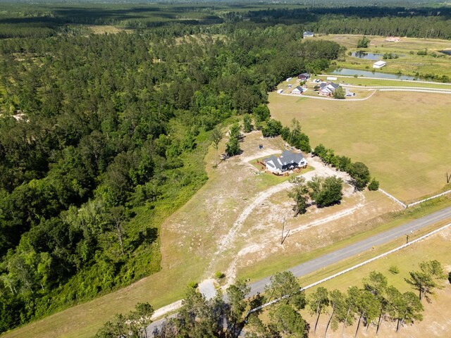 4310 Old Quitman Hwy, Valdosta, GA 31601 - aerial overview of property's location with a heavily wooded area, a large body of water, and rural landscape