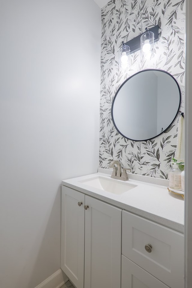 4310 Old Quitman Hwy, Valdosta, GA 31601 - bathroom featuring wallpapered walls, vanity, and baseboards