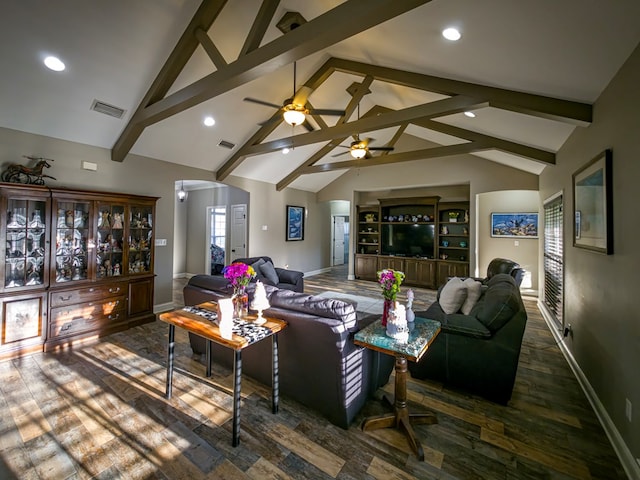 living area with beam ceiling, visible vents, baseboards, and wood finished floors