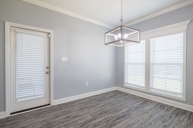 unfurnished dining area featuring ornamental molding, baseboards, dark wood-style flooring, and a chandelier