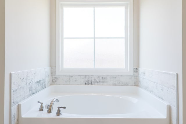 full bathroom featuring a bath