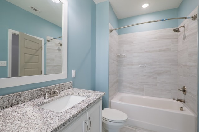 bathroom with vanity, toilet, tub / shower combination, and visible vents