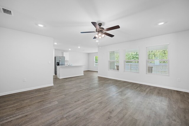 3638 Seedling Ln, Valdosta, GA 31601 - unfurnished living room featuring ceiling fan, recessed lighting, dark wood finished floors, and baseboards