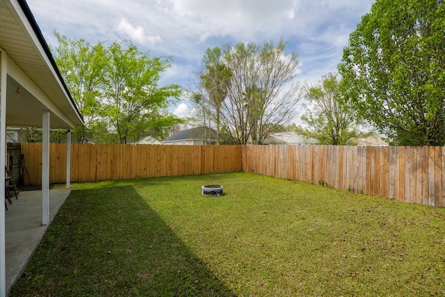 view of yard with a fenced backyard