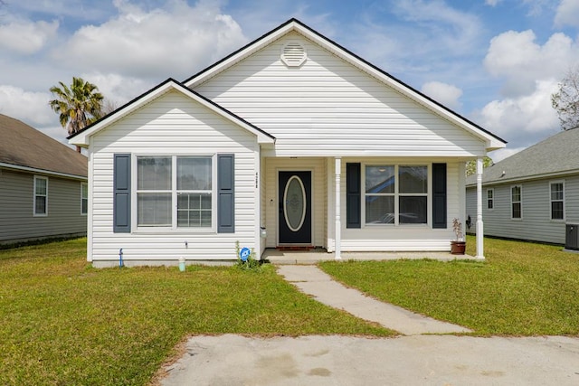 bungalow with central air condition unit and a front yard