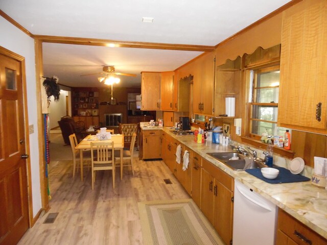 kitchen with white dishwasher, sink, light hardwood / wood-style flooring, ceiling fan, and ornamental molding