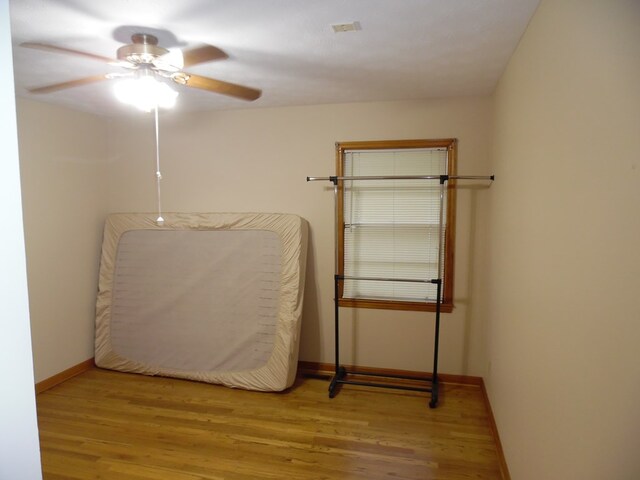 bedroom with ceiling fan and light wood-type flooring