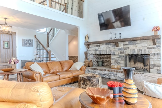 35 Tyler Rd, Naylor, GA 31641 - living room with a fireplace, stairway, ornamental molding, a high ceiling, and a chandelier