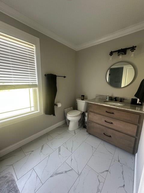 35 Tyler Rd, Naylor, GA 31641 - half bathroom with marble finish flooring, crown molding, baseboards, vanity, and toilet