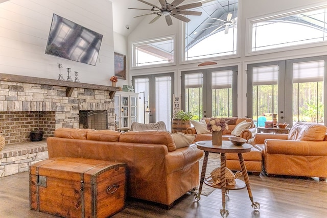 35 Tyler Rd, Naylor, GA 31641 - living area featuring french doors, ceiling fan, wood finished floors, a fireplace, and high vaulted ceiling