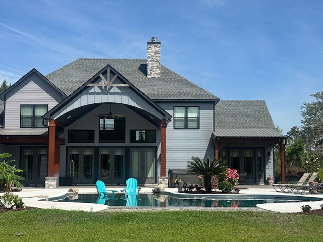 35 Tyler Rd, Naylor, GA 31641 - back of property featuring french doors, a yard, and a shingled roof