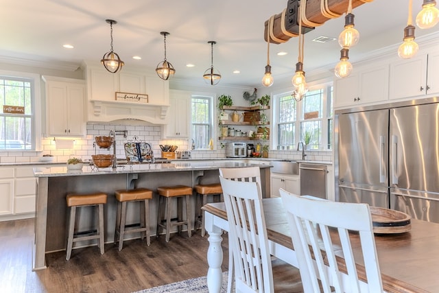 35 Tyler Rd, Naylor, GA 31641 - kitchen featuring stainless steel appliances, crown molding, backsplash, white cabinetry, and a sink