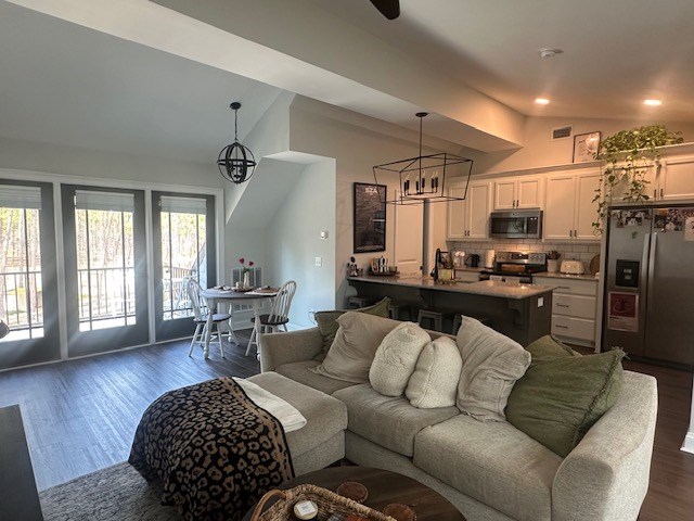 35 Tyler Rd, Naylor, GA 31641 - living room with vaulted ceiling, a chandelier, dark wood finished floors, and recessed lighting
