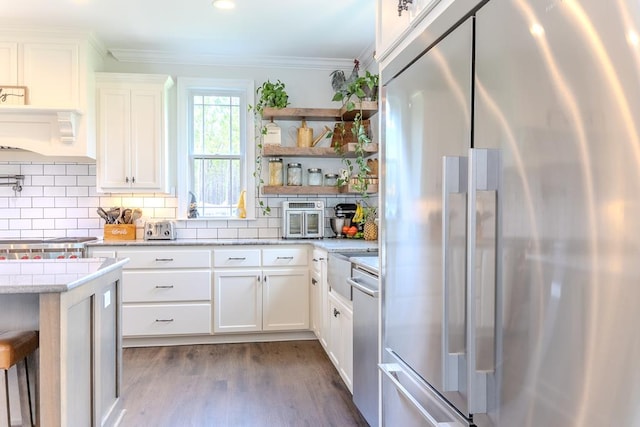 35 Tyler Rd, Naylor, GA 31641 - kitchen with appliances with stainless steel finishes, open shelves, ornamental molding, wood finished floors, and decorative backsplash