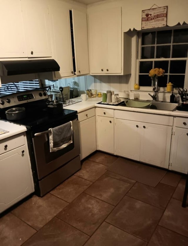 kitchen featuring sink, white cabinets, and stainless steel range with electric stovetop