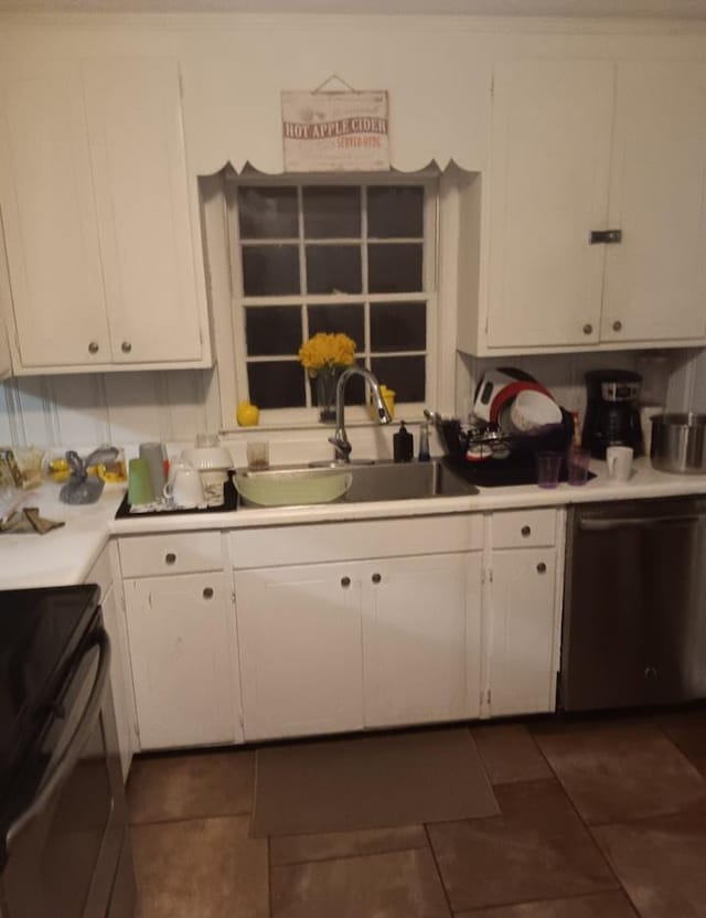 kitchen featuring electric range, white cabinetry, stainless steel dishwasher, and sink