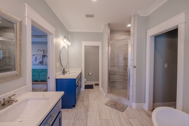 4809 Brown Cat Cir, Hahira, GA 31632 - bathroom with a shower stall, ornamental molding, two vanities, recessed lighting, and a freestanding bath