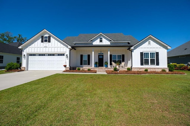 4809 Brown Cat Cir, Hahira, GA 31632 - modern farmhouse featuring board and batten siding, covered porch, concrete driveway, and a front lawn
