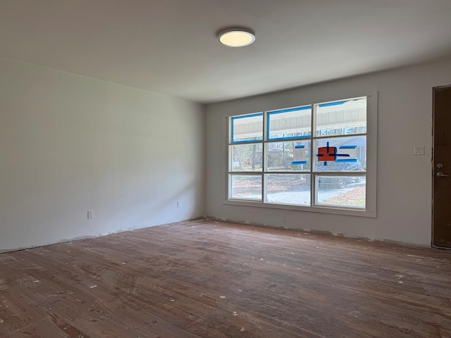 unfurnished room featuring wood finished floors