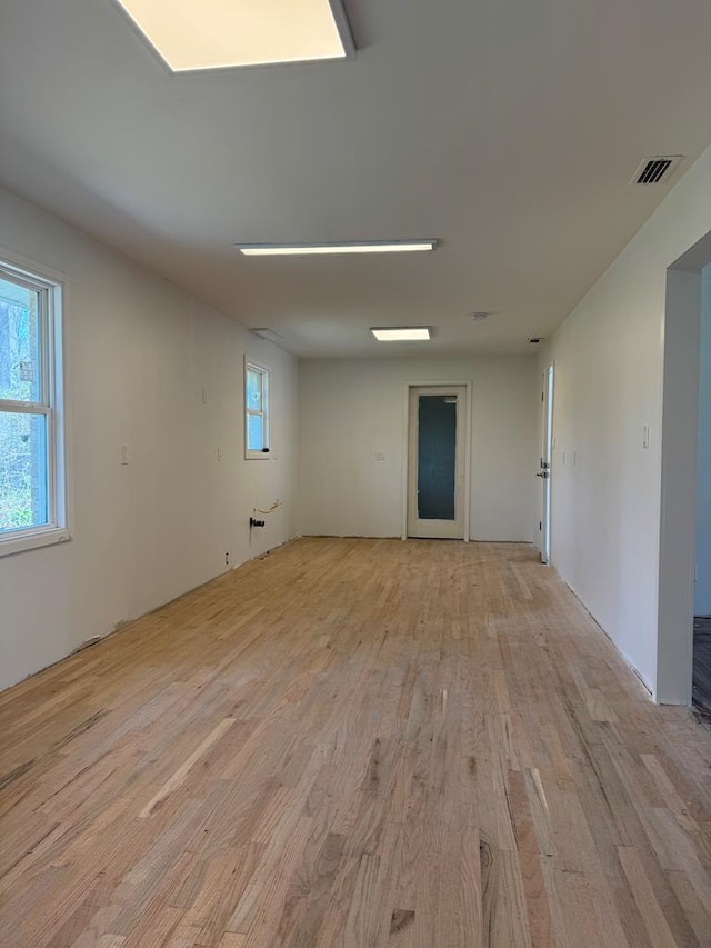 spare room with visible vents and light wood-type flooring