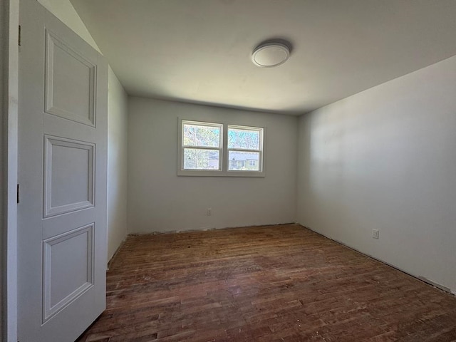 spare room with wood finished floors